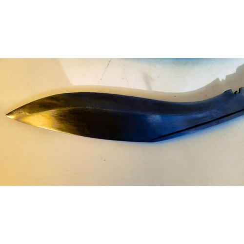 127 - A 20thC kukri with a brass mounted handle, a 16