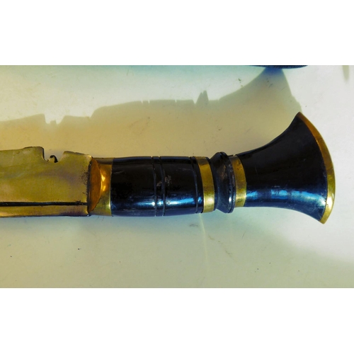 127 - A 20thC kukri with a brass mounted handle, a 16