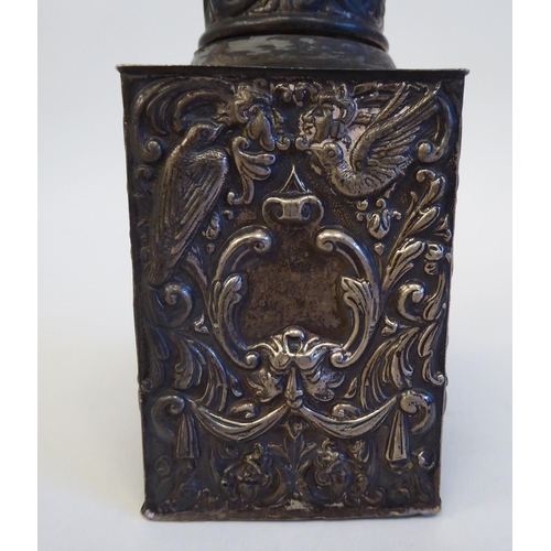 133 - A late Victorian silver tea caddy of shouldered, rectangular box design, the cover incorporating a b... 