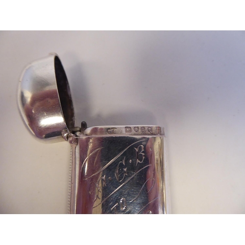 137 - A silver cushion moulded hip flask with a rotating, hinged cap; and a lozenge shape vesta case with ... 