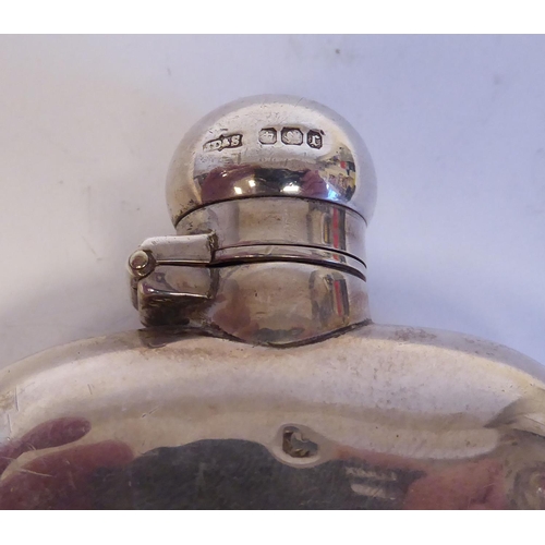 137 - A silver cushion moulded hip flask with a rotating, hinged cap; and a lozenge shape vesta case with ... 