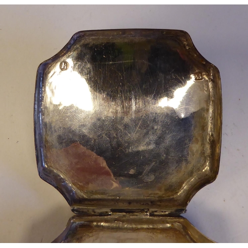 139 - A silver trinket box of elongated, incurved hexagonal form with a hinged lid; another, Continental s... 