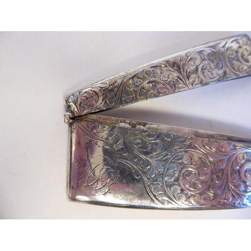 143 - Four late Victorian/Edwardian silver collectables, viz. a scroll engraved visiting card holder; anot... 