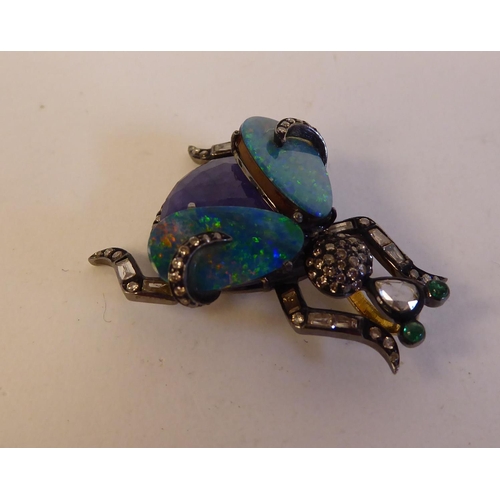 149 - An antique bi-coloured metal beetle pendant, variously set with opals and diamonds