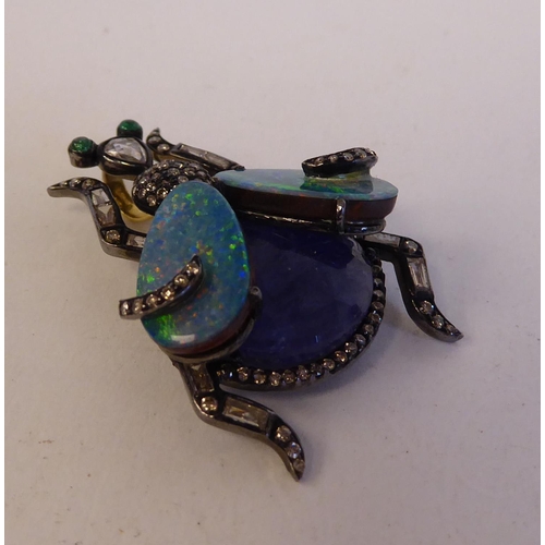 149 - An antique bi-coloured metal beetle pendant, variously set with opals and diamonds