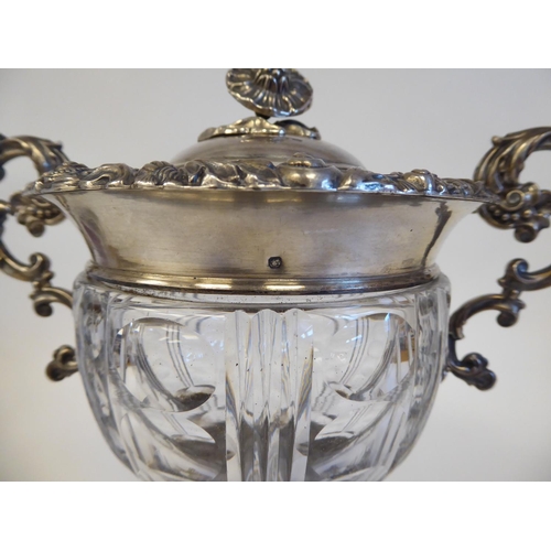 155 - A Continental white metal ice bucket with a cut glass bowl, set in a twin handled frame with a lid, ... 