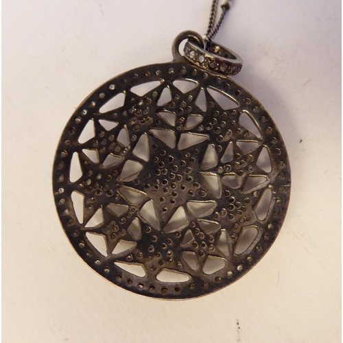 156 - A diamond set pendant, on a fine neckchain