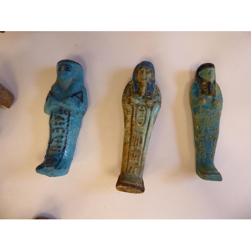 174 - Ancient earthenware pottery and fragments: to include jugs and Shabti type figures  largest 6