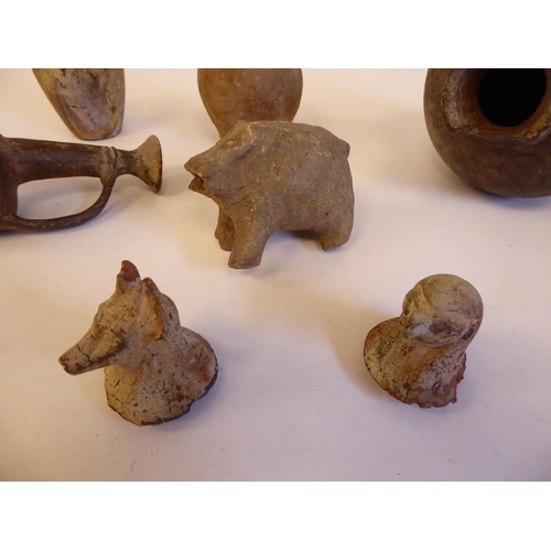 174 - Ancient earthenware pottery and fragments: to include jugs and Shabti type figures  largest 6