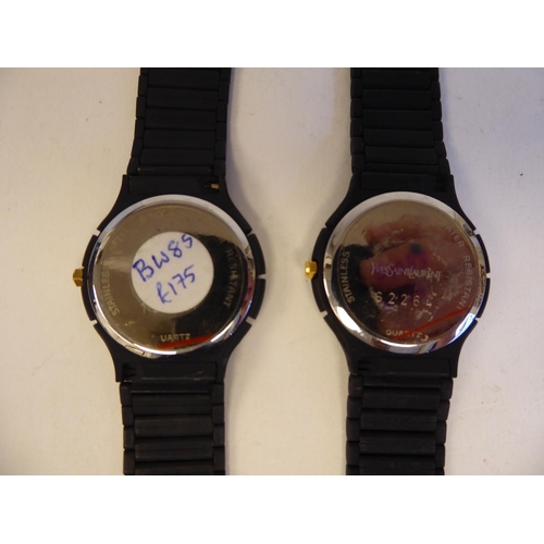 184 - Two similar ladies Yves St Laurent black cased, bracelet wristwatches, the quartz movements with dat... 