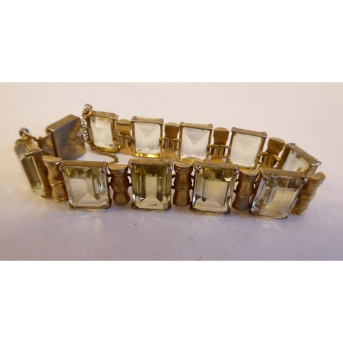 191 - Three variously set yellow metal, smokey quartz and citrine bracelets