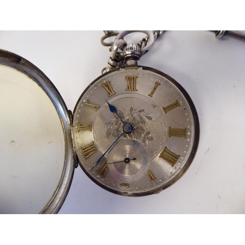 205 - A silver cased pocket watch, faced by a floral engraved and gilded Roman dial, on a silver curb link... 