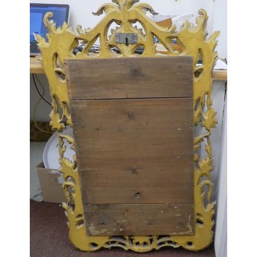 217 - A 19thC mirror, set in a floral carved and scrolled giltwood frame  40