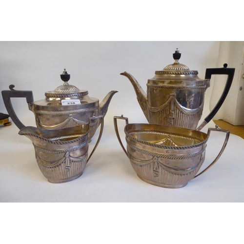 238 - A late Victorian silver four piece tea set of oval, demi-reeded, draped and gadrooned form, the teap... 