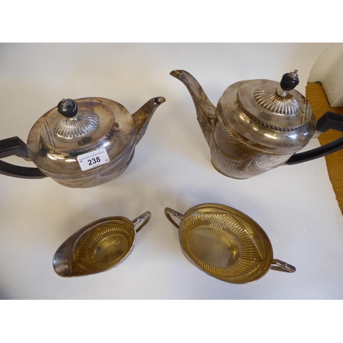 238 - A late Victorian silver four piece tea set of oval, demi-reeded, draped and gadrooned form, the teap... 