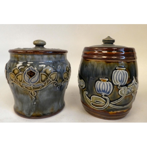 24 - A Royal Doulton stoneware tobacco jar and lid, decorated in tubeline with Art Nouveau inspired, flor... 