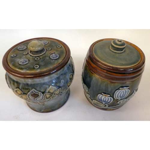 24 - A Royal Doulton stoneware tobacco jar and lid, decorated in tubeline with Art Nouveau inspired, flor... 