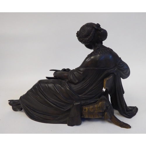 240 - A late 19thC cast and patinated bronze figure, a young woman reclining on a cushioned stool, looking... 