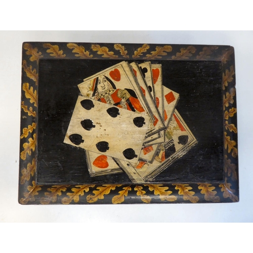 254 - A 19thC playing card box with a hinged lid, decorated with oak leaves and a part deck of cards, on g... 