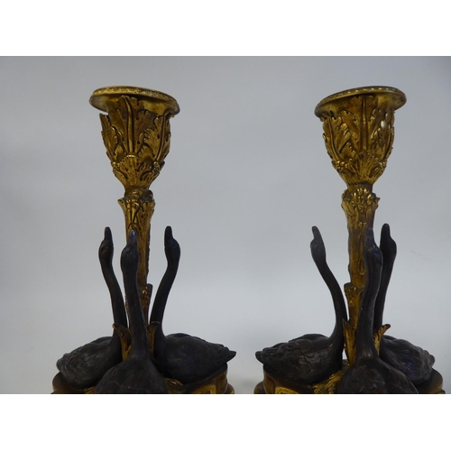 256 - A pair of gilt and patinated bronze candlesticks, designed by William Bateman II for Rundall, Bridge... 