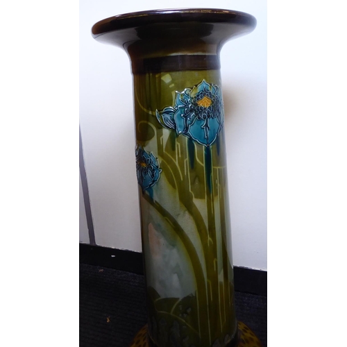 258 - A late Victorian ceramic pedestal, decorated in colours and part tubeline with stylised flora  ... 