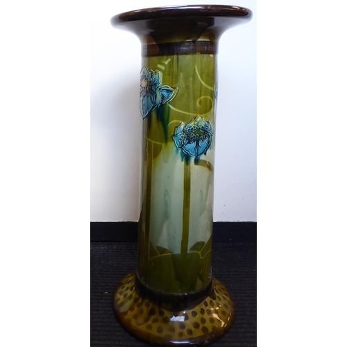 258 - A late Victorian ceramic pedestal, decorated in colours and part tubeline with stylised flora  ... 