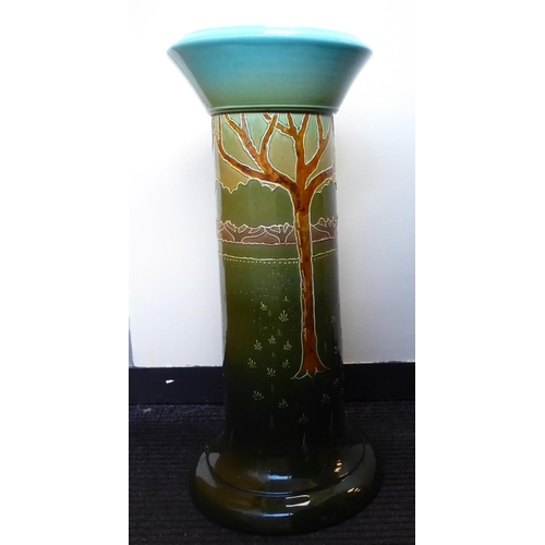 259 - A late Victorian ceramic pedestal, decorated in colours and tubeline with stylised trees  26