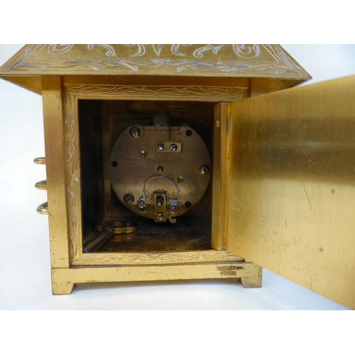 264 - A French Garley Inc Just gilt metal cased mantel clock, in the form of a four pitched roof, over a s... 