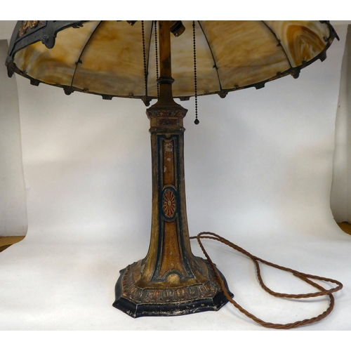 269 - An Arts & Crafts painted metal table lamp with a tapered column, on a decoratively formed base, ... 