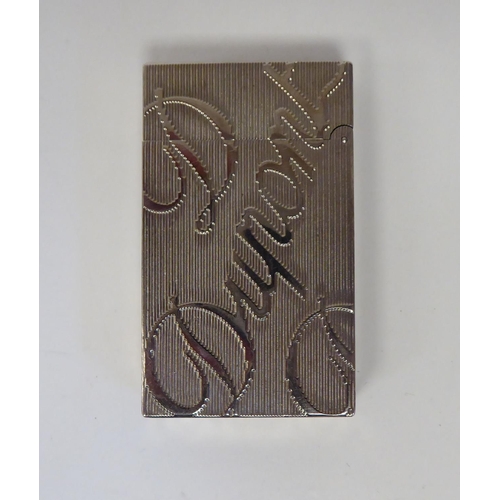 285 - A Dupont rectangular, stainless steel cased, gas filled cigarette lighter, decorated in large script... 