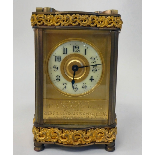 288 - A mid 20thC gilt metal cased carriage timepiece with decoratively cast frieze ornament, beaded glass... 