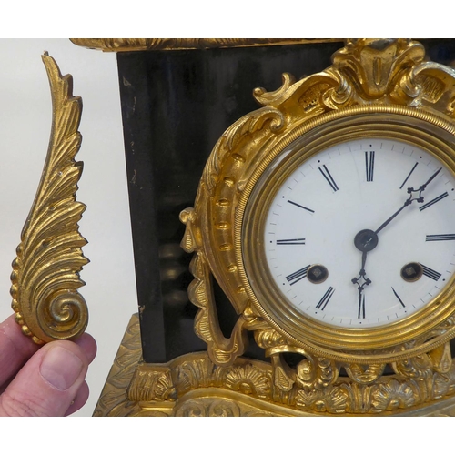 289 - A late 19thC black slate cased and gilt metal mounted mantel clock, surmounted by a classical 'goat ... 