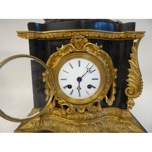 289 - A late 19thC black slate cased and gilt metal mounted mantel clock, surmounted by a classical 'goat ... 