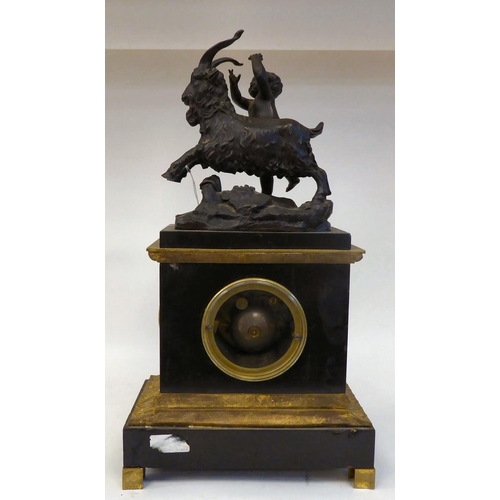 289 - A late 19thC black slate cased and gilt metal mounted mantel clock, surmounted by a classical 'goat ... 