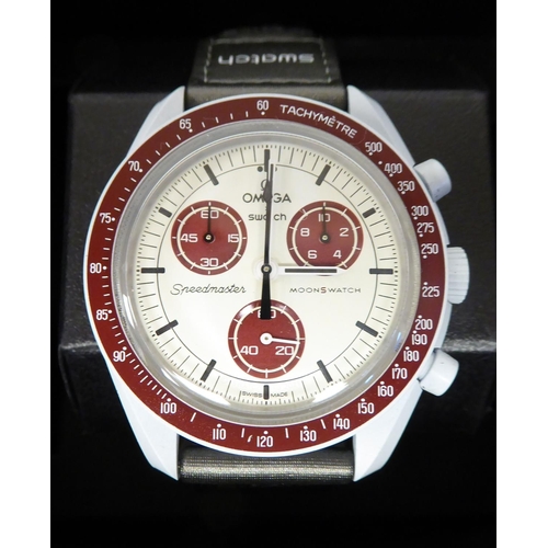 291 - An Omega Speedmaster wristwatch, on a dedicated watch strap, faced by a baton dial and three subsidi... 