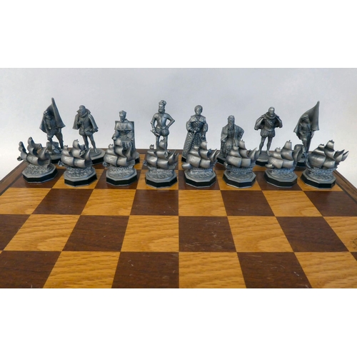 293 - A Danbury Mint 'The Armada Chess Set' (No.2144) crafted in pewter, in an oak box and board with a ce... 