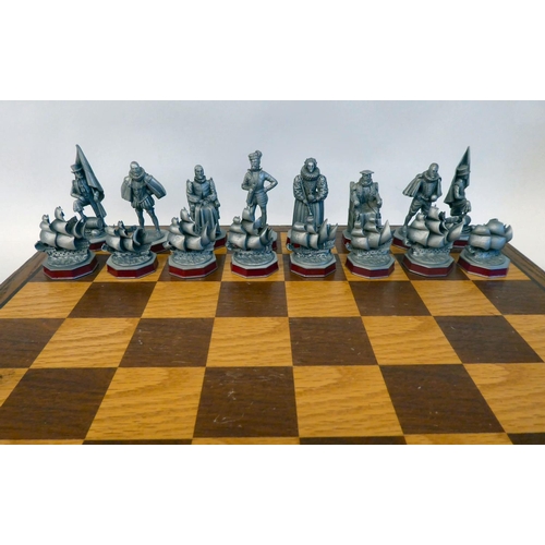 293 - A Danbury Mint 'The Armada Chess Set' (No.2144) crafted in pewter, in an oak box and board with a ce... 