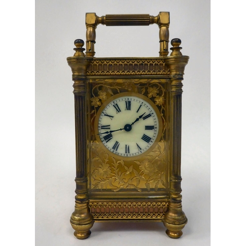 295 - A mid 20thC gilt metal cased carriage timepiece with outset pillow fretworked decoration, bevelled g... 