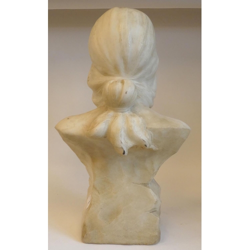 3 - An Art Nouveau carved white marble bust, a maiden with her hair tied back and ornamented with traili... 