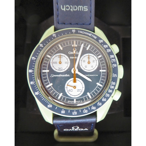 300 - An Omega Speedmaster wristwatch, on a dedicated swatch strap, faced by a baton dial and three subsid... 