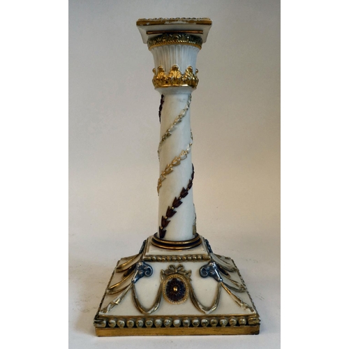 33 - A Royal Worcester biscuit glazed china candlestick, decorated in neo-classical taste with silvered r... 