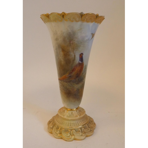 38 - A Royal Worcester china trumpet shape specimen vase, decorated with pheasants and highlighted in gil... 