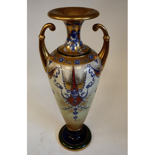 39 - A late 19thC Forester's Indianesque china twin handled vase of slender, tapered, baluster form with ... 