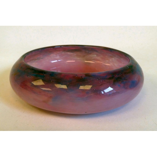 46 - A Moncrieff Monart glass pin dish, decorated in tones of purple/pink  bears an applied label  4