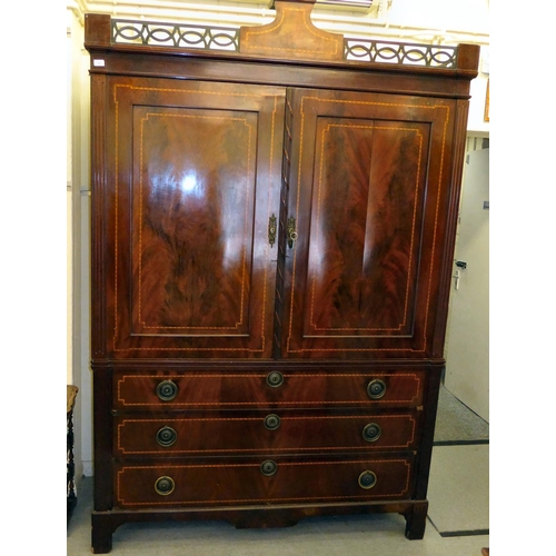 53 - An early 19thC satinwood inlaid, mahogany linen press with a pierced, fretworked cornice, over two p... 