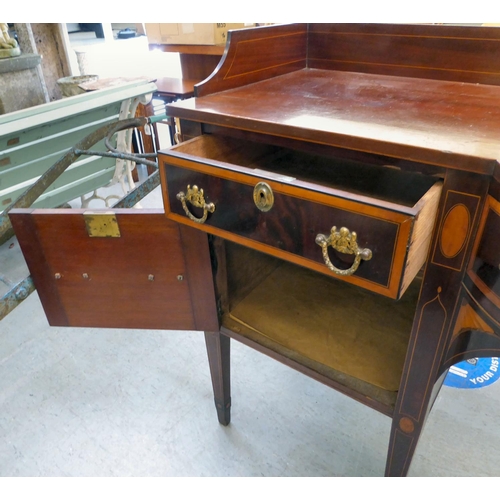 54 - A Regency Irish satinwood inlaid, mahogany breakfront sideboard with three inline drawers, above a c... 