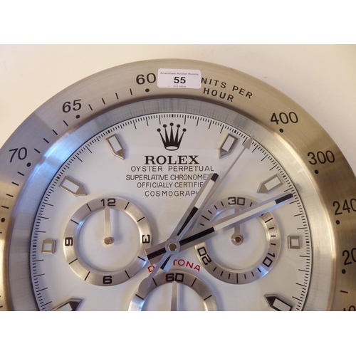 55 - A dealer display advertising wall timepiece for 'Rolex Oyster Perpetual'; the movement with three su... 