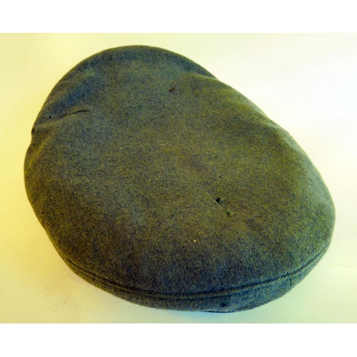 58 - A World War II German Luftwaffe peaked cap with emblems(Please Note: this lot is subject to the stat... 