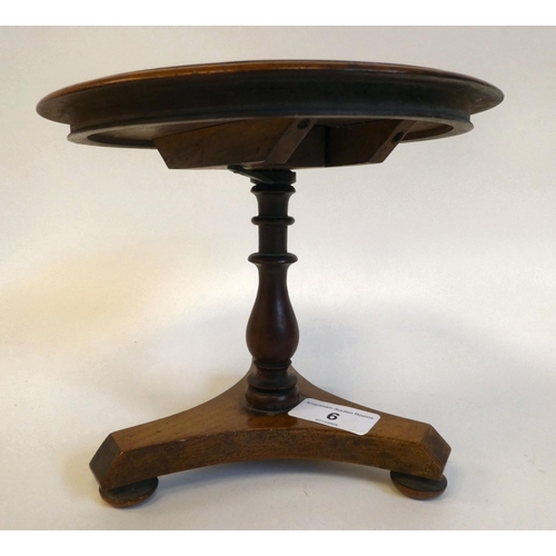 6 - A 19thC miniature mahogany centre table, in the manner of an apprentice piece, the tip-top over a ba... 