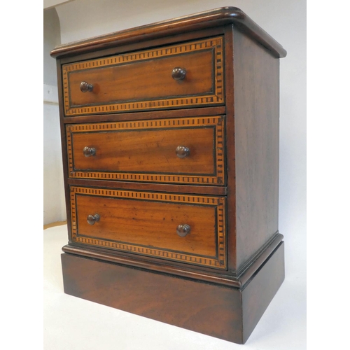 7 - A late 19thC mahogany table top collector's chest with three graduated long drawers and inlaid borde... 